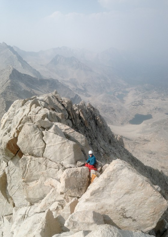 My partner right below the summit block. Notice the haze in the sky from the Rough Fire down south in Sequoia & Kings Canyon National Park